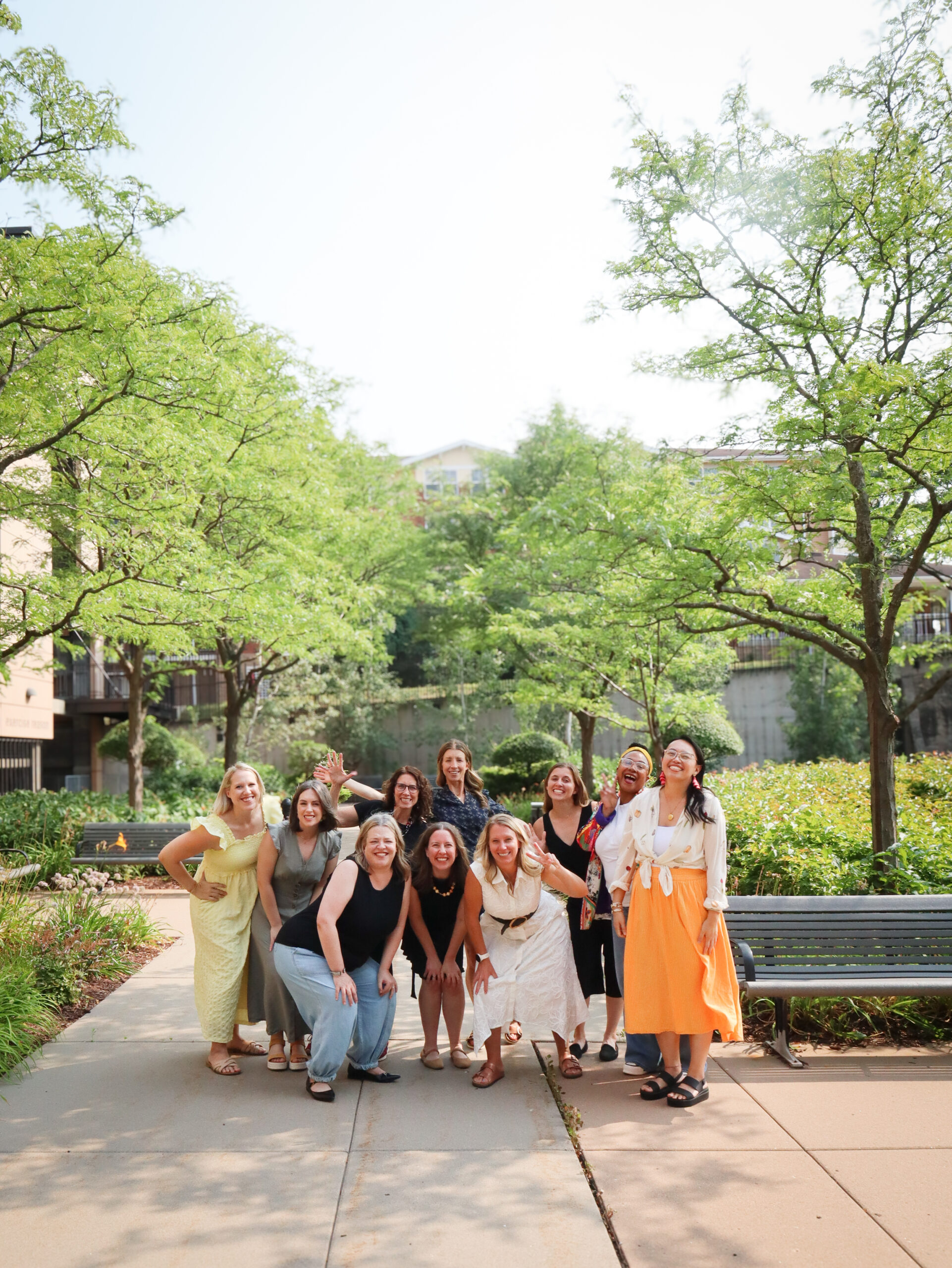 ECO Cohort 10 graduates smiling together outdoors after completing the Executive Coaching in Organizations program.